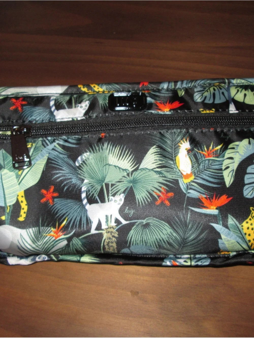 lug Tropical Animal Print Cosmetic Bag in Black with Green and Orange Accents